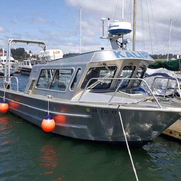 A silver metal fishing boat.